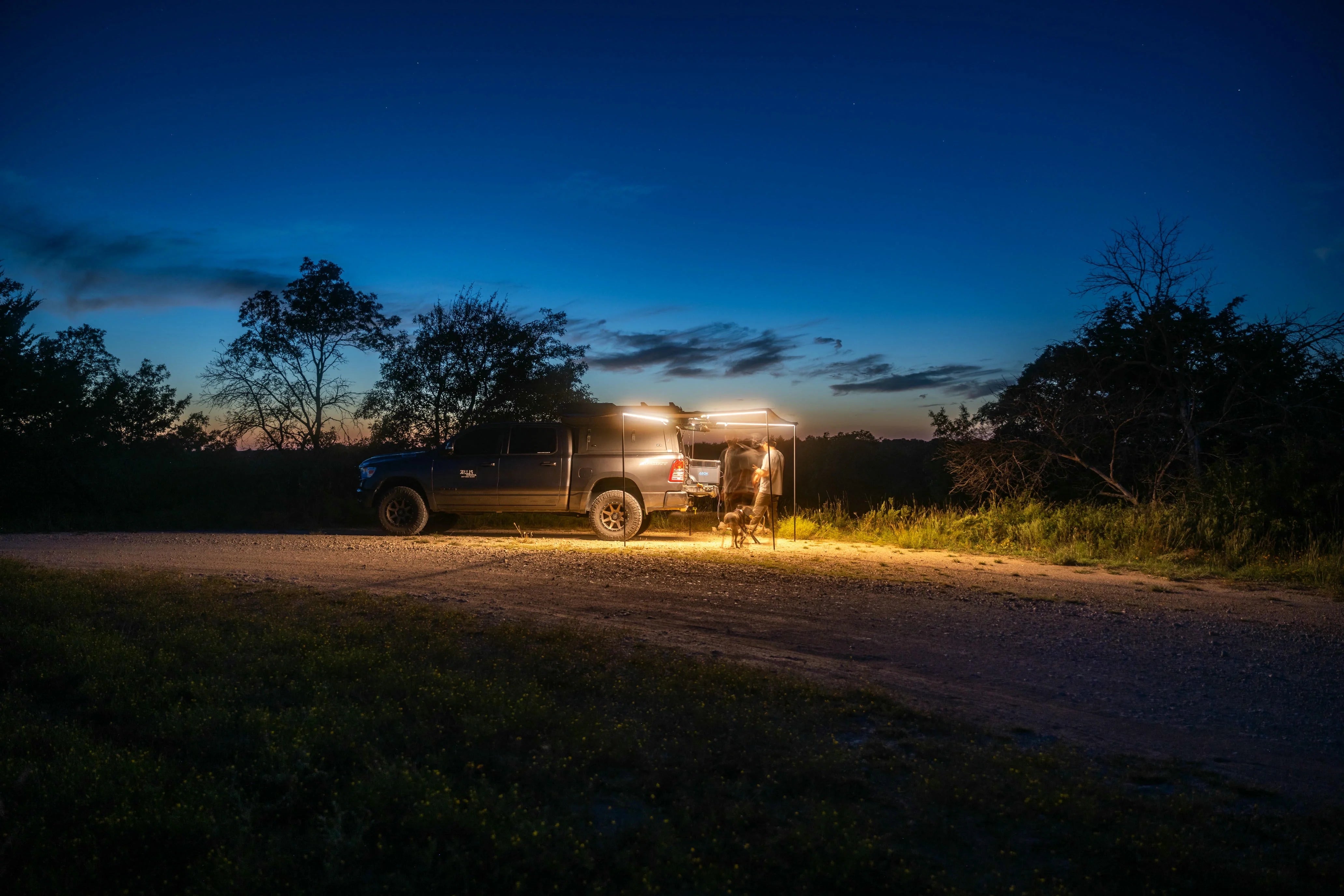 ABOK truck campsite using portable power at night in humid outdoor conditions.