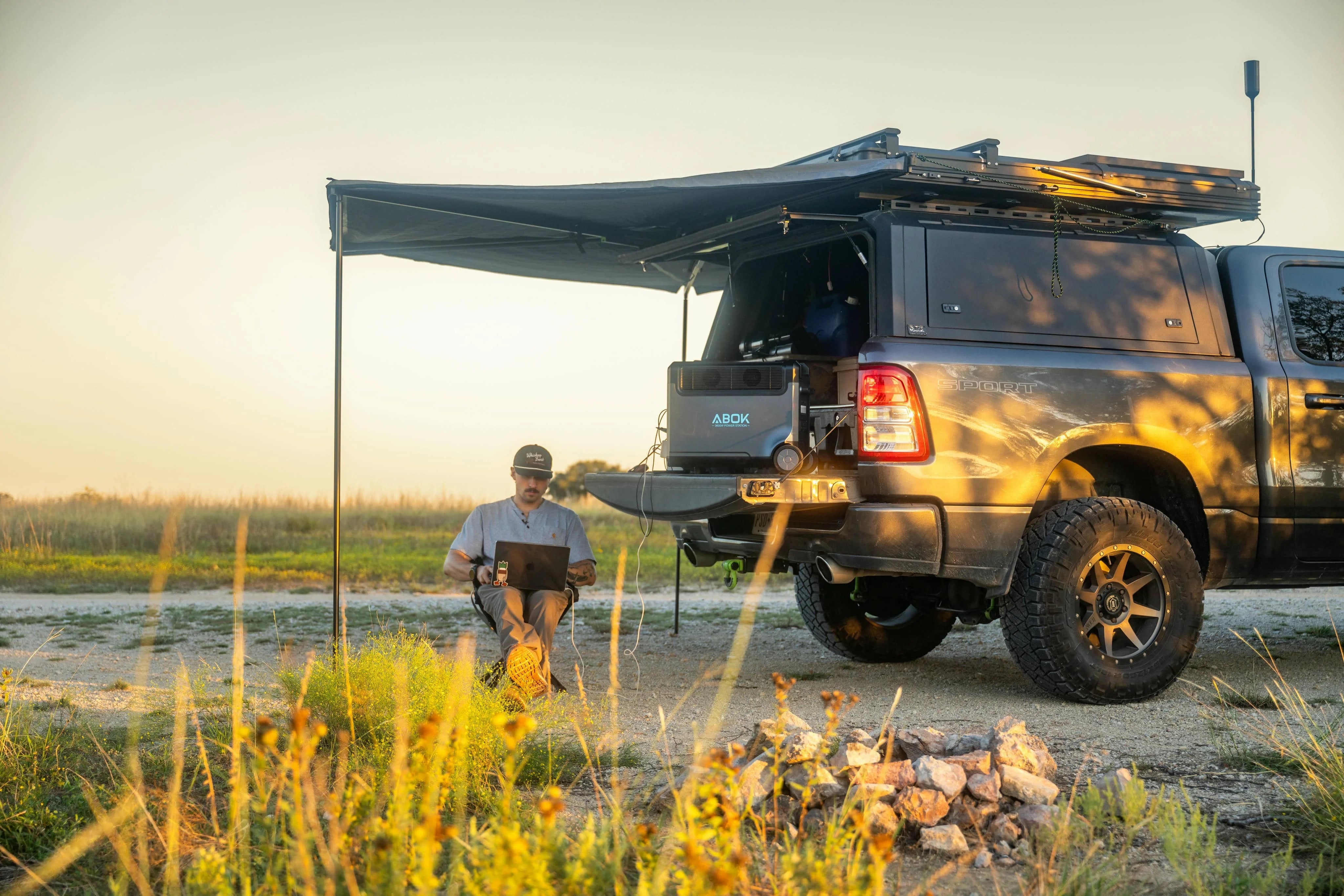 ABOK truck campsite at sunset illustrating responsible outdoor energy use.