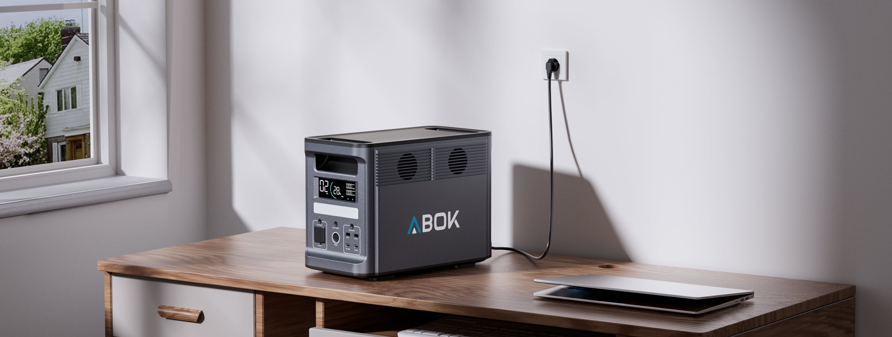 ABOK Ark2000 wide home scene showing the EU-spec power station connected to a wall outlet for an 80-minute full charge.