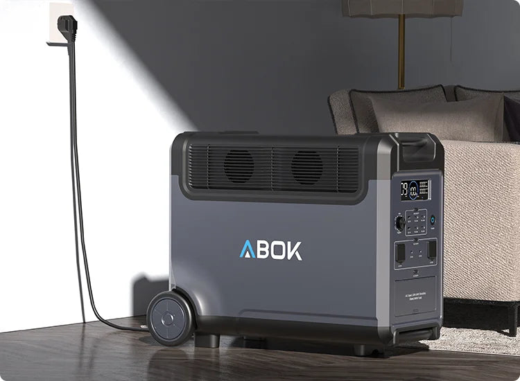 ABOK Ark3600 EU-spec portable power station charging from a wall outlet in a living room.